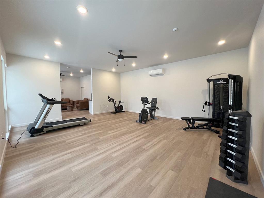 7721 Dutch Branch Road, Unit 1B Fort Worth, TX 76132 - Photo 3 of 9 a view of a room with gym equipment