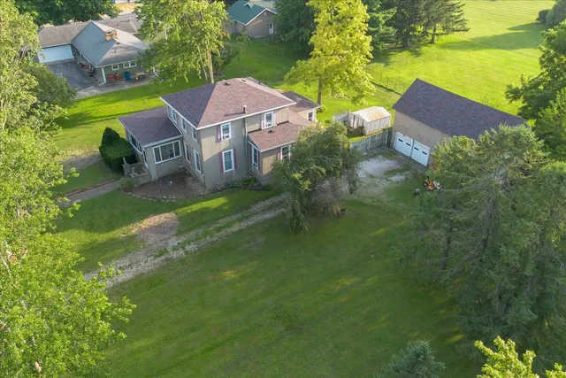 an aerial view of a house with a garden