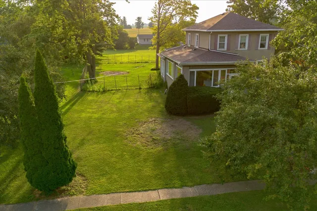 a view of residential houses with yard