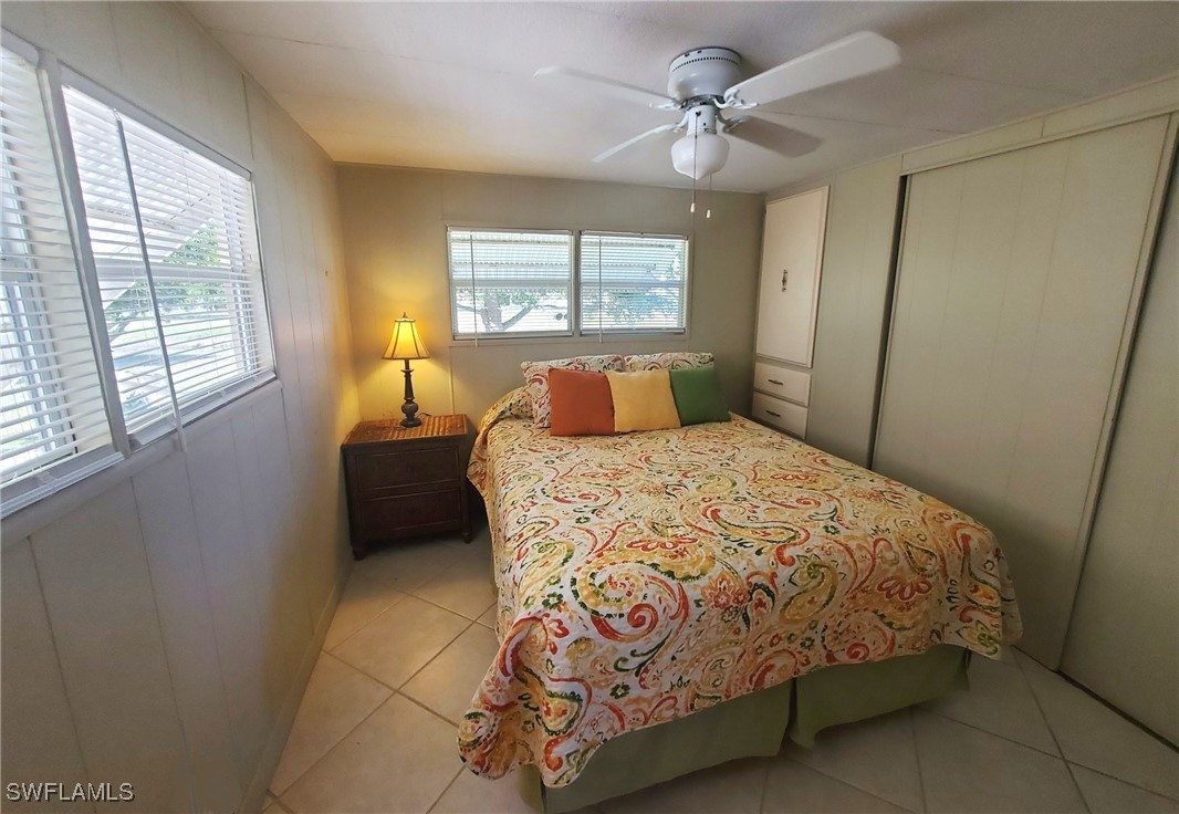 938 Lazy Lane North Fort Myers, FL 33917 - Photo 11 of 37 a bedroom with a bed and window