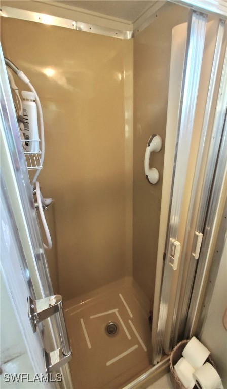 938 Lazy Lane North Fort Myers, FL 33917 - Photo 18 of 37 a bathroom with a shower and a sink