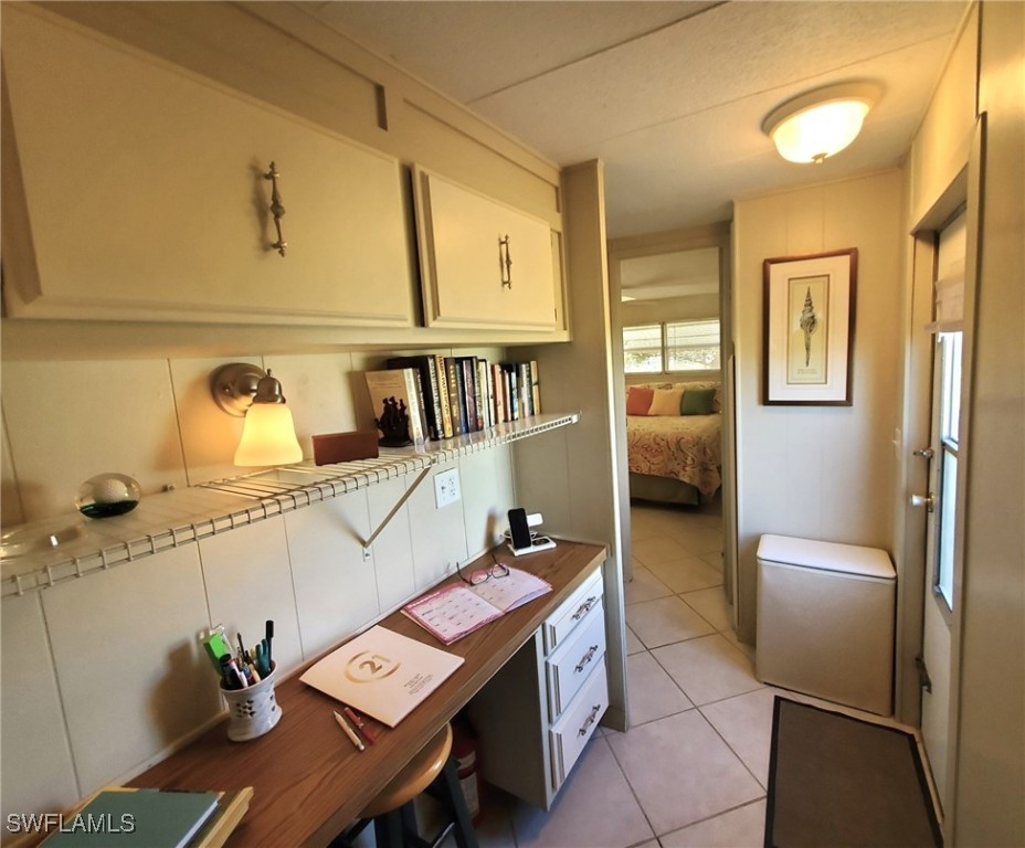 938 Lazy Lane North Fort Myers, FL 33917 - Photo 20 of 37 a living room with stainless steel appliances furniture a rug and a view of kitchen