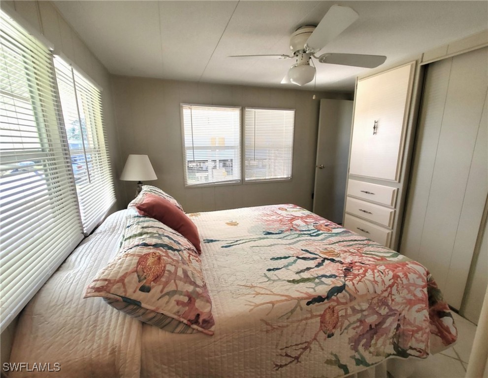 938 Lazy Lane North Fort Myers, FL 33917 - Photo 21 of 37 a bedroom with a bed and a window