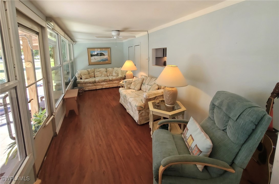 938 Lazy Lane North Fort Myers, FL 33917 - Photo 22 of 37 a bedroom with furniture and a large window