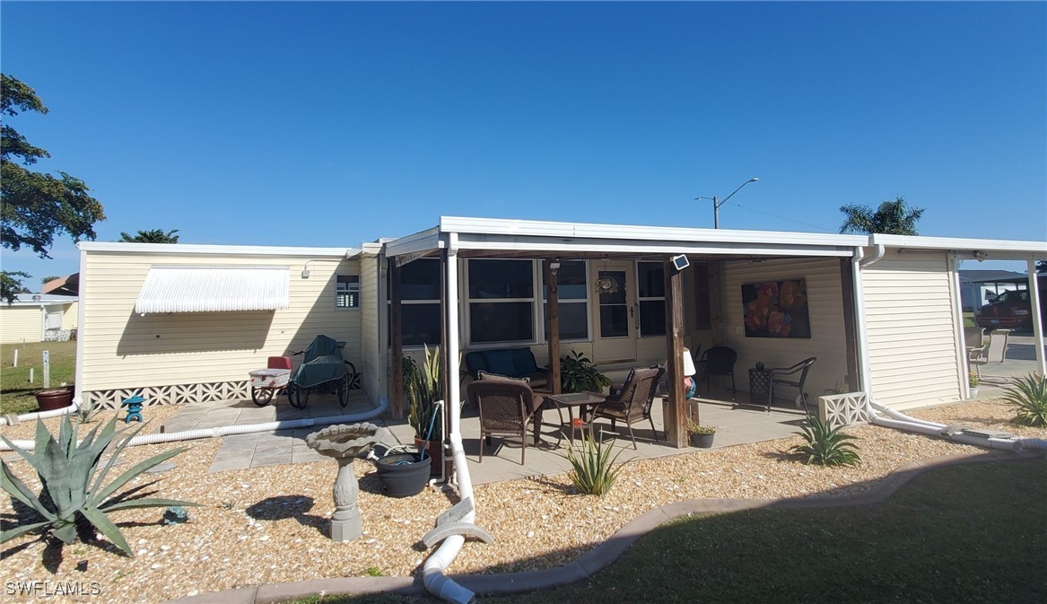 938 Lazy Lane North Fort Myers, FL 33917 - Photo 26 of 37 a house view with a sitting space and balcony