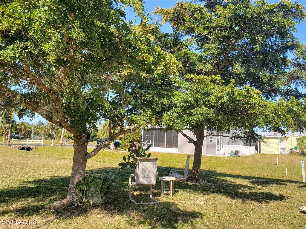 938 Lazy Lane North Fort Myers, FL 33917 - Photo 28 of 37 a view of a park with large trees