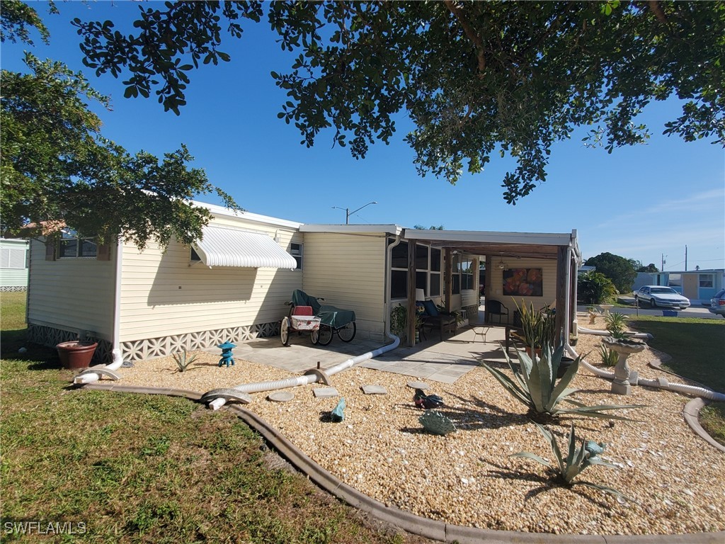 938 Lazy Lane North Fort Myers, FL 33917 - Photo 29 of 37 a view of a house with backyard