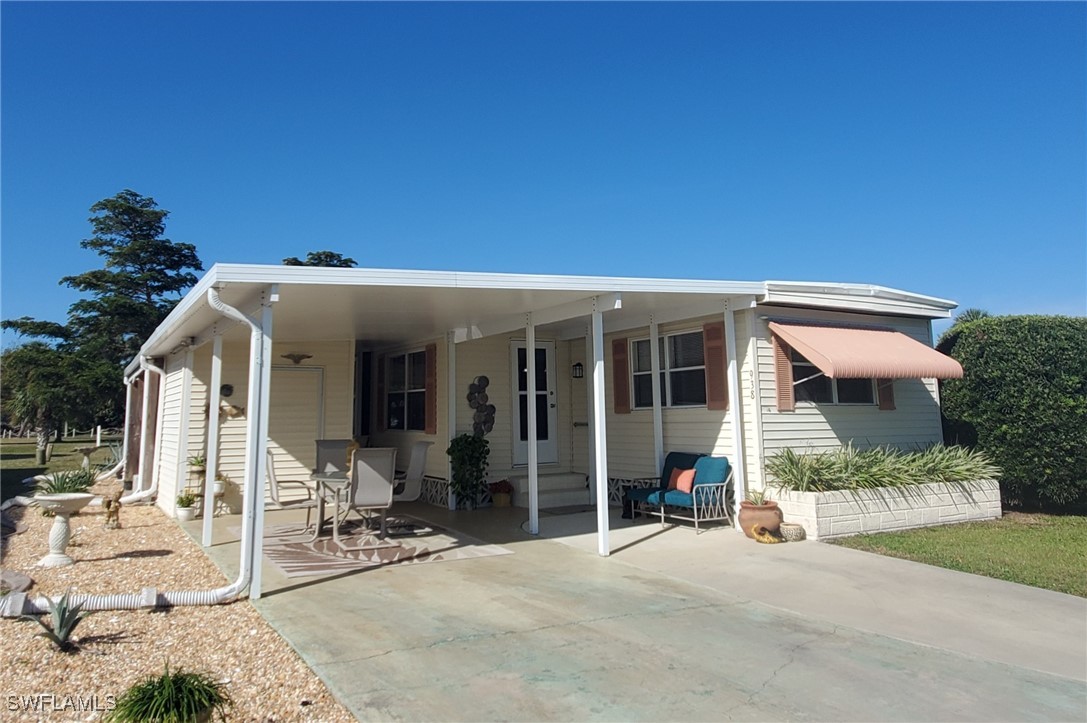 938 Lazy Lane North Fort Myers, FL 33917 - Photo 30 of 37 a view of a house with patio