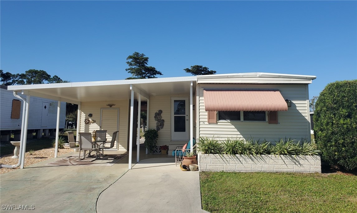 938 Lazy Lane North Fort Myers, FL 33917 - Photo 31 of 37 front view of a house with a porch