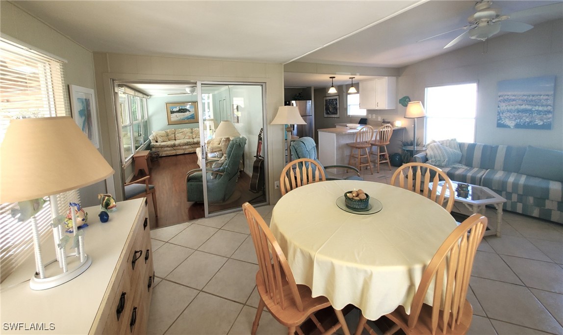 938 Lazy Lane North Fort Myers, FL 33917 - Photo 7 of 37 a dining room with furniture and window
