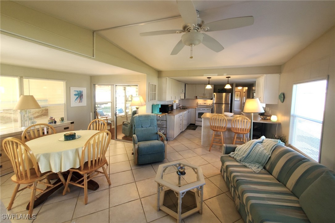938 Lazy Lane North Fort Myers, FL 33917 - Photo 10 of 37 a living room with furniture and a large window