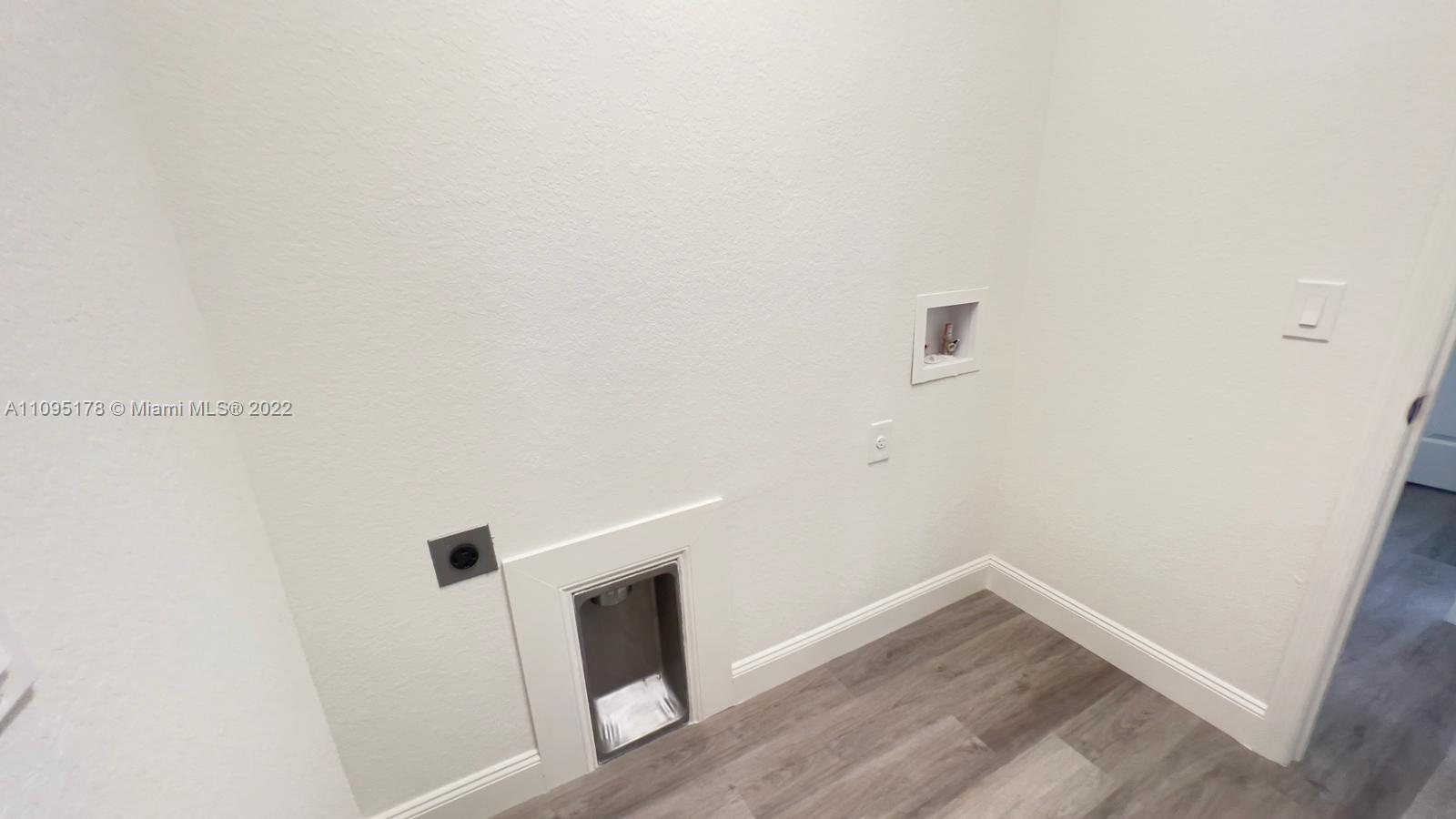 3911 Ordnance Road Lehigh Acres, FL 33971 - Photo 6 of 10 a view of small space with wooden floor