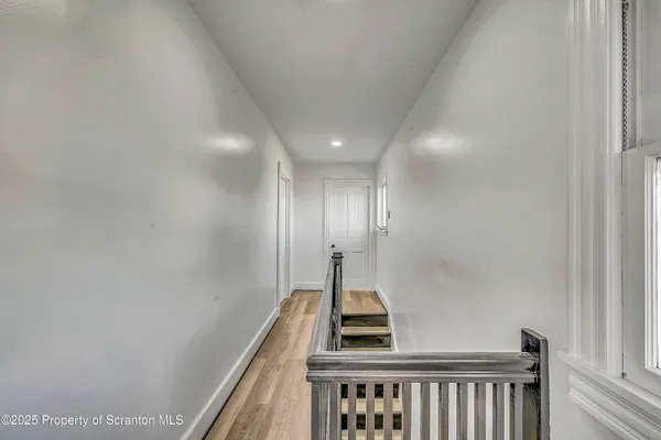 a view of an empty room with stairs