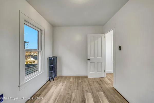 a view of an empty room and window