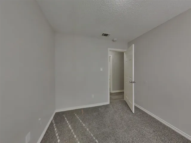 a bathroom with a sink mirror and toilet