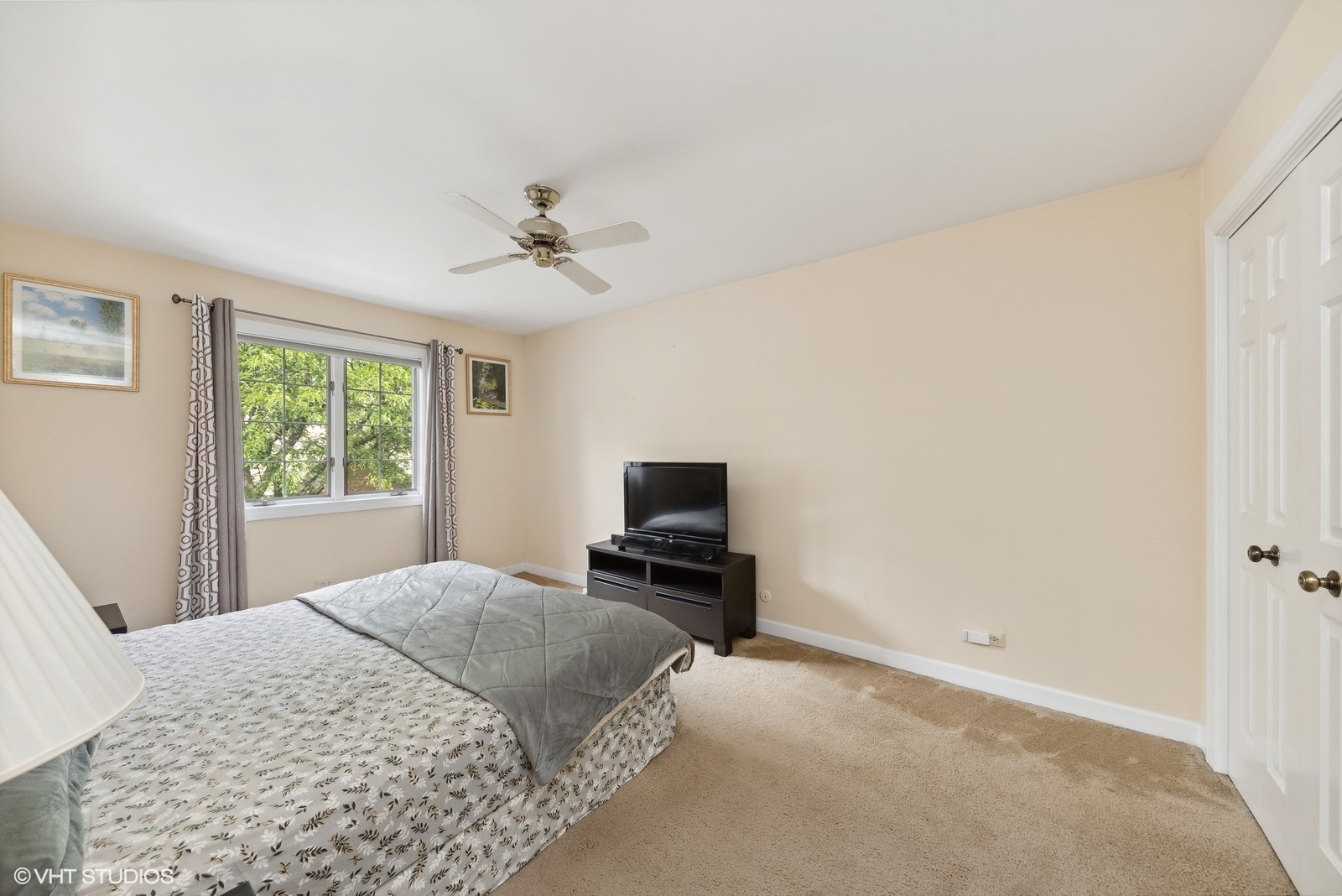 1483 West Shire Circle Inverness, IL 60067 - Photo 13 of 23 a bedroom with a bed and a flat screen tv
