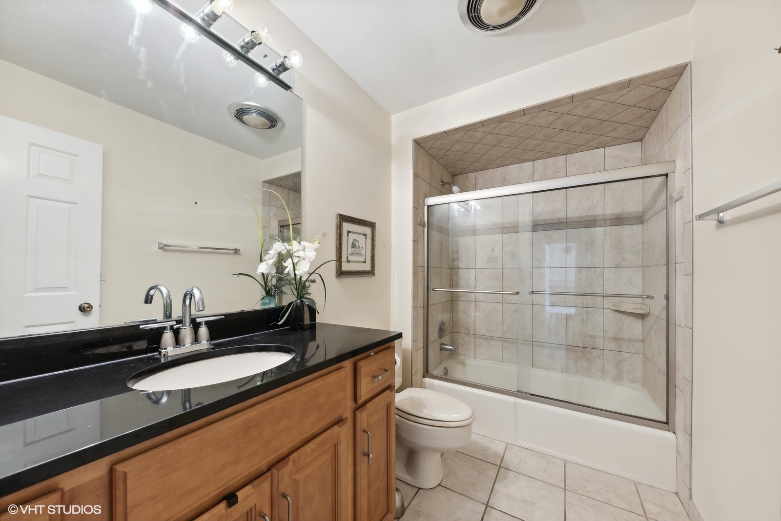 1483 West Shire Circle Inverness, IL 60067 - Photo 15 of 23 a bathroom with a granite countertop sink a toilet and shower