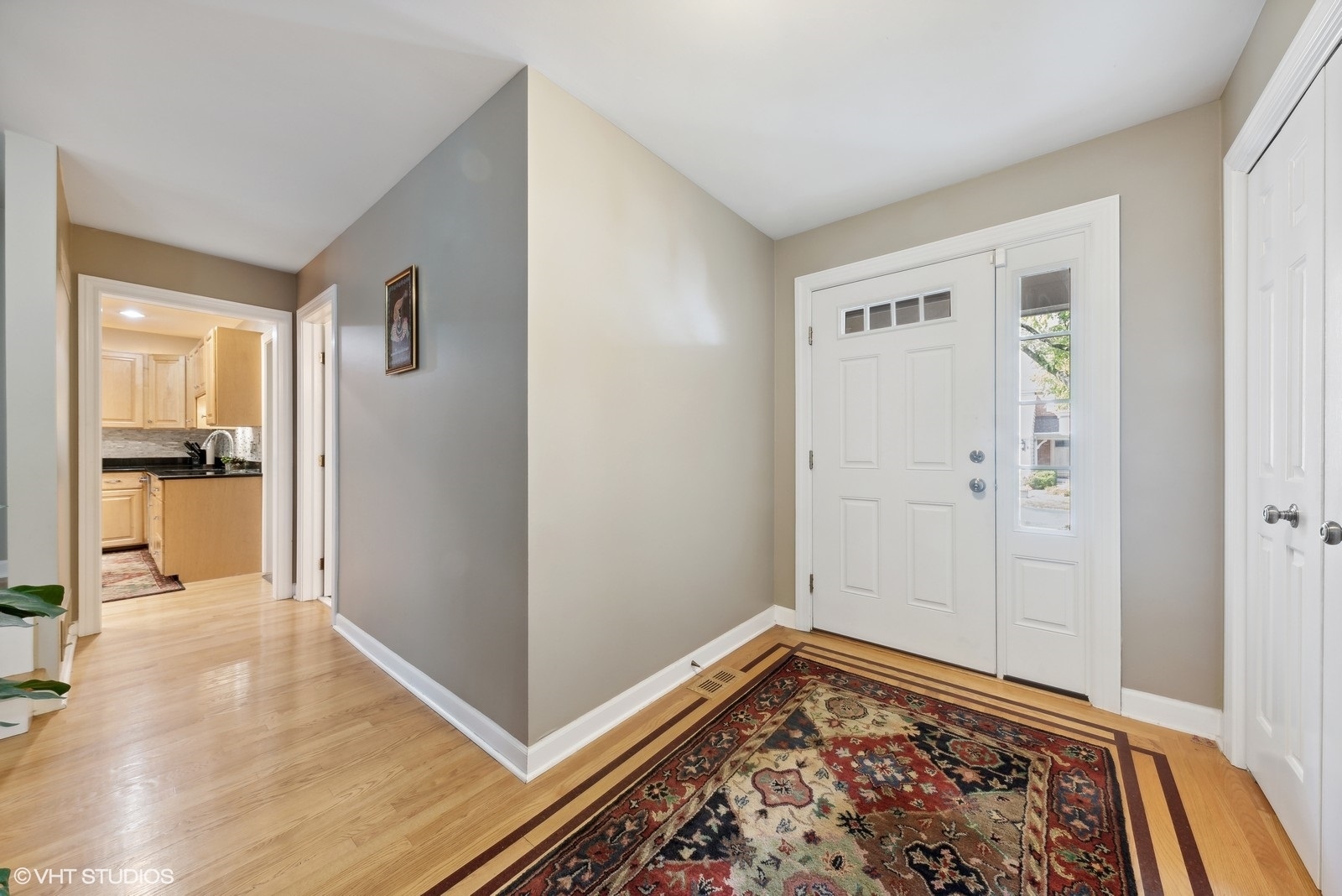 1483 West Shire Circle Inverness, IL 60067 - Photo 2 of 23 a view of a hallway with wooden floor and a bedroom