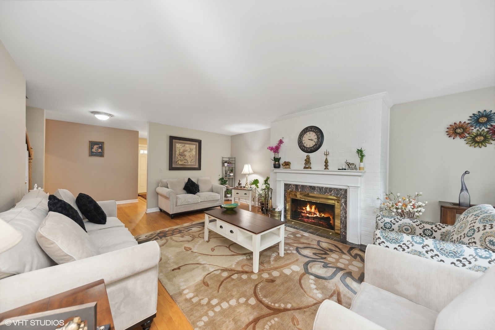 1483 West Shire Circle Inverness, IL 60067 - Photo 5 of 23 a living room with furniture a fireplace and wooden floor