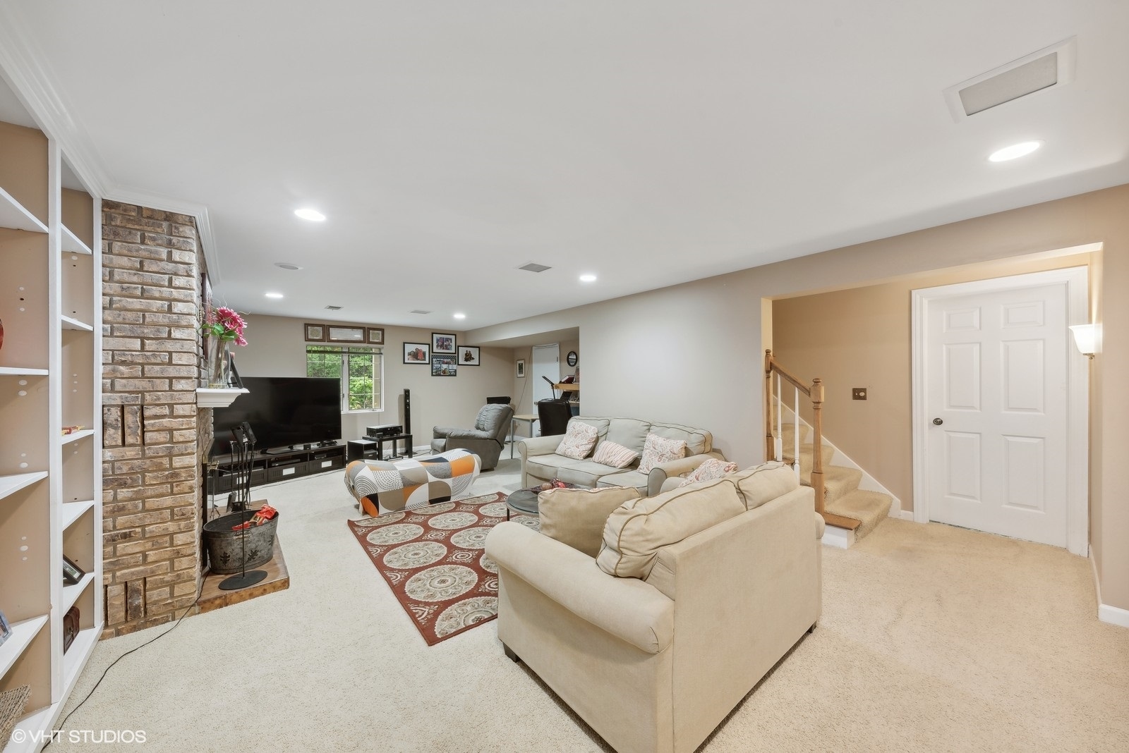 1483 West Shire Circle Inverness, IL 60067 - Photo 9 of 23 a living room with furniture a flat screen tv and a large window