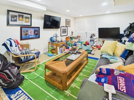 a room with furniture and a flat screen tv