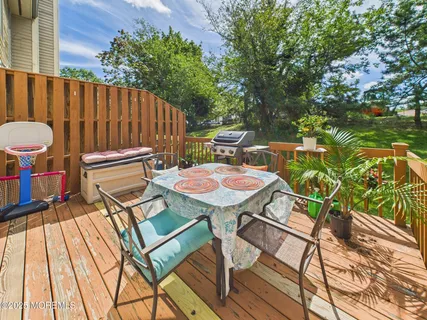 a table and chairs in the outdoor space