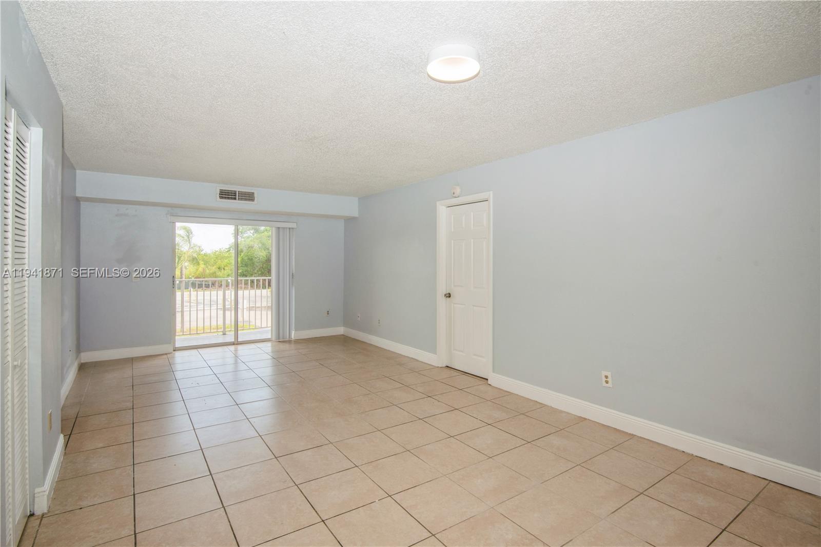 8200 Southwest 210th Street, Unit 111 Cutler Bay, FL 33189 - Photo 16 of 23 an empty room with windows