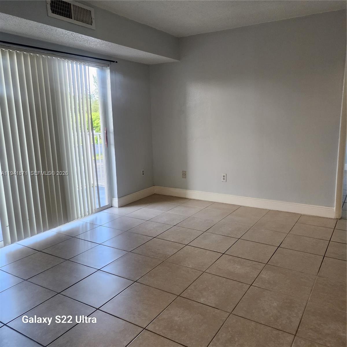 8200 Southwest 210th Street, Unit 111 Cutler Bay, FL 33189 - Photo 2 of 23 a view of an empty room and window