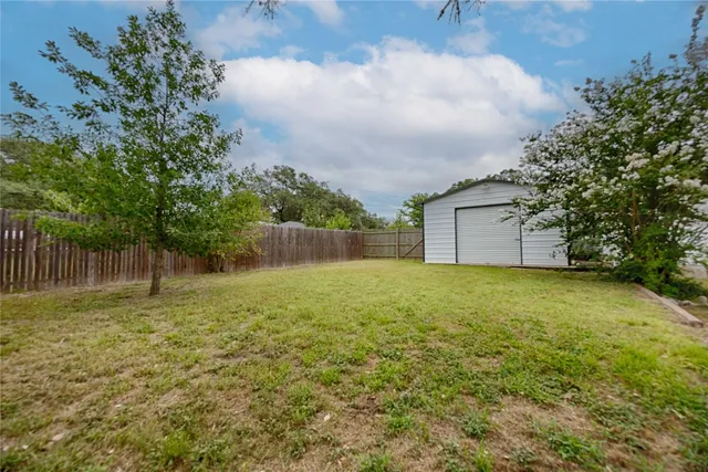 a backyard of a house with lots of green space
