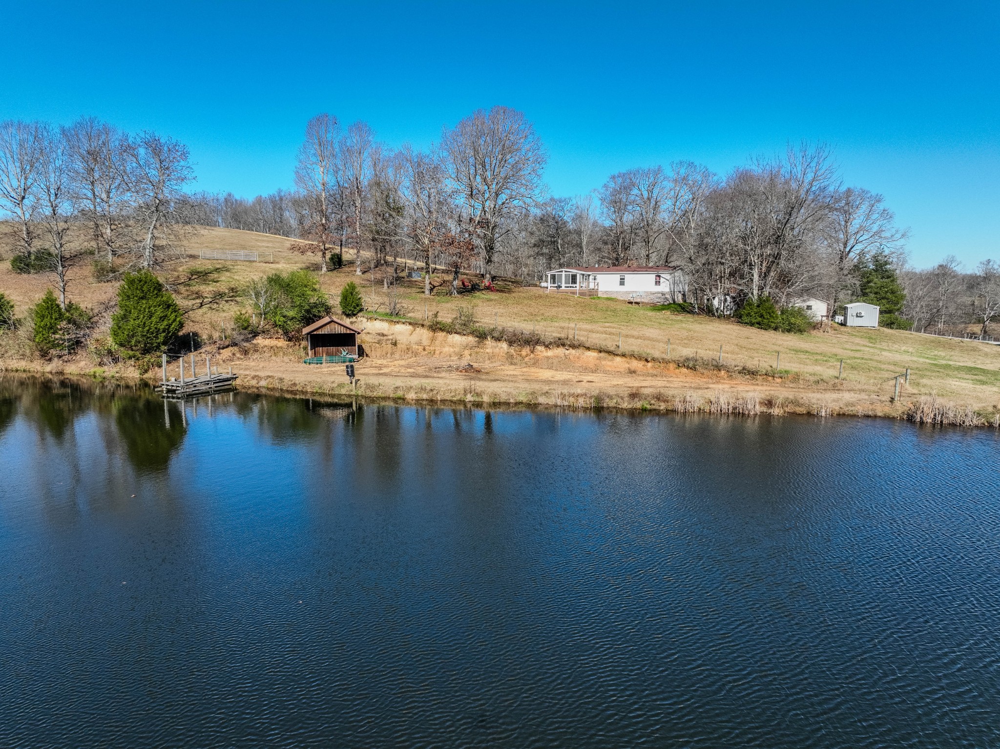 a view of residential houses with outdoor space and lake view