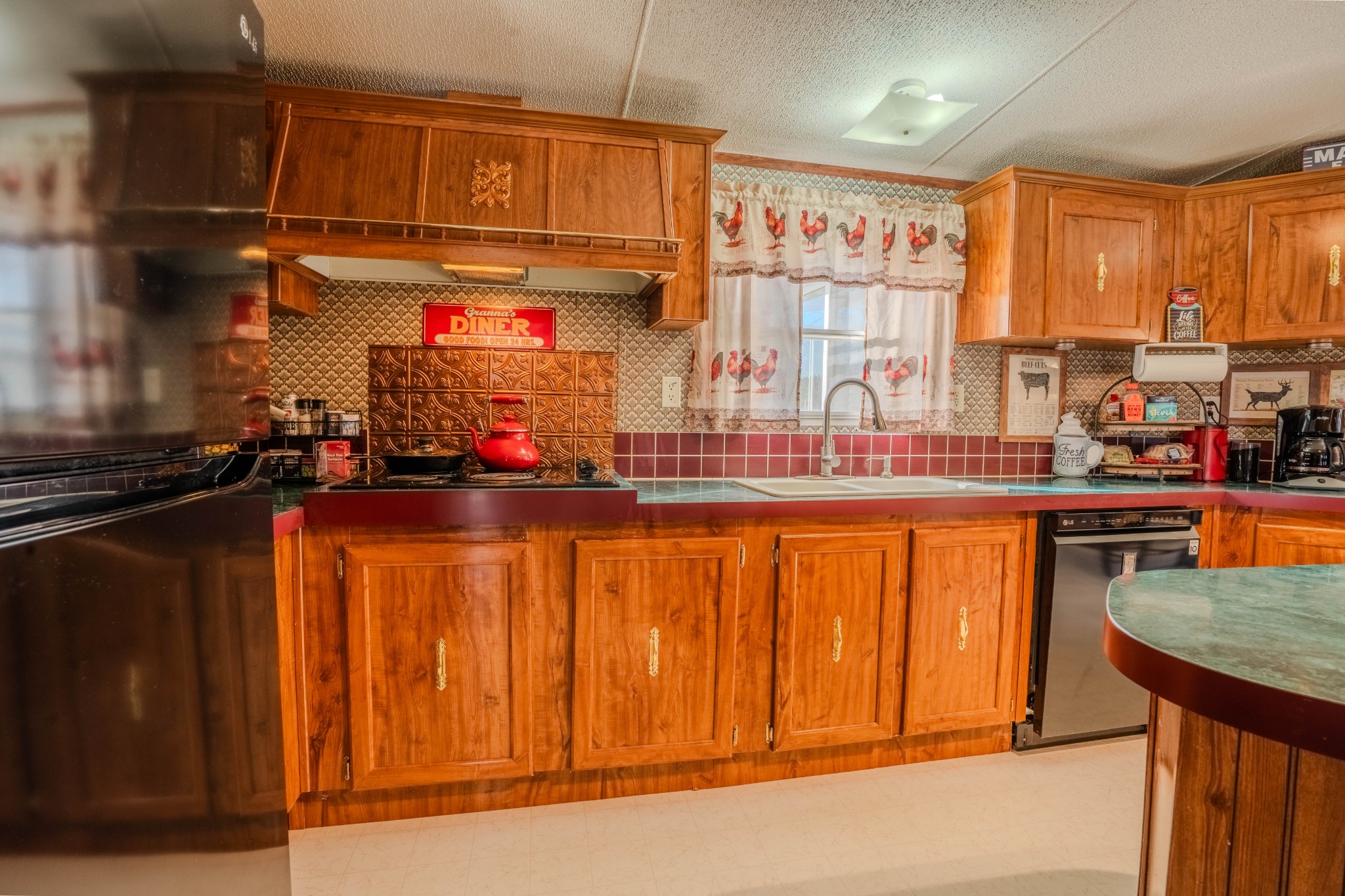 875 Waterloo Road Westpoint, TN 38486 - Photo 15 of 59 a kitchen with stainless steel appliances wooden cabinets and a counter top space