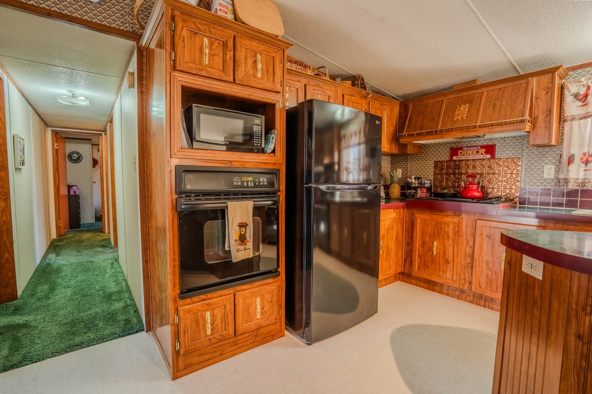 875 Waterloo Road Westpoint, TN 38486 - Photo 15 of 60 a kitchen with stainless steel appliances granite countertop a refrigerator a stove and a sink with granite countertops