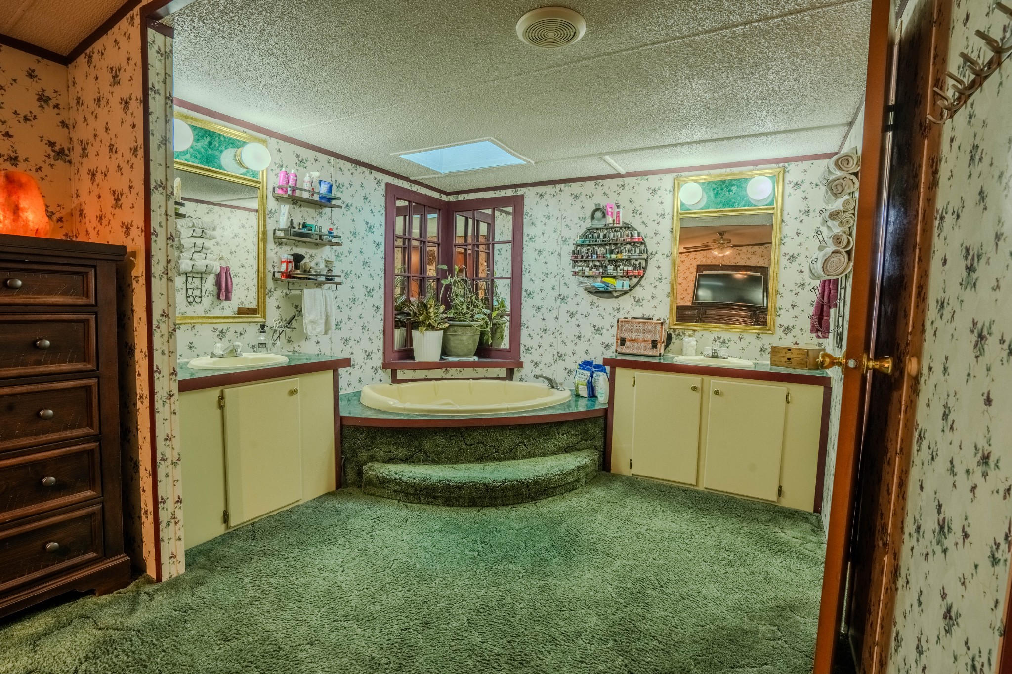 875 Waterloo Road Westpoint, TN 38486 - Photo 17 of 59 a bathroom with a granite countertop sink mirror and a bathtub