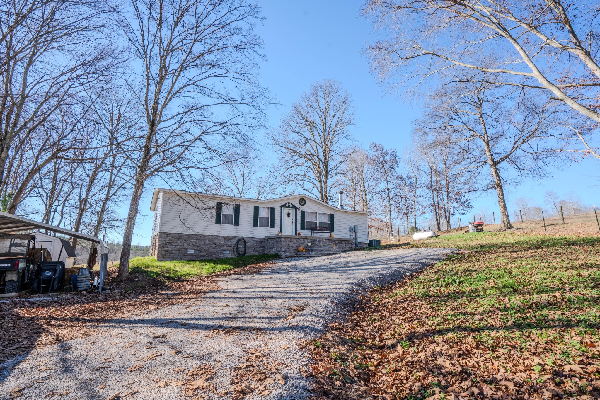 875 Waterloo Road Westpoint, TN 38486 - Photo 8 of 60 a house that has a tree in front of it
