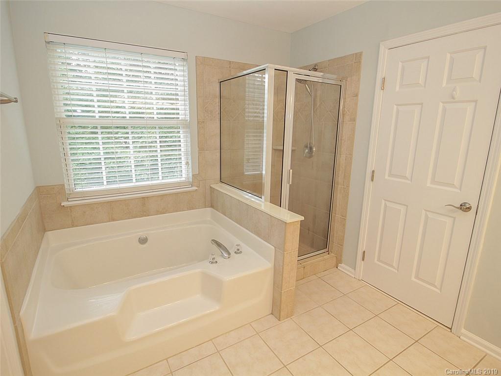 854 Knightsbridge Road Fort Mill, SC 29708 - Photo 14 of 26 a bathroom with a bathtub and a shower