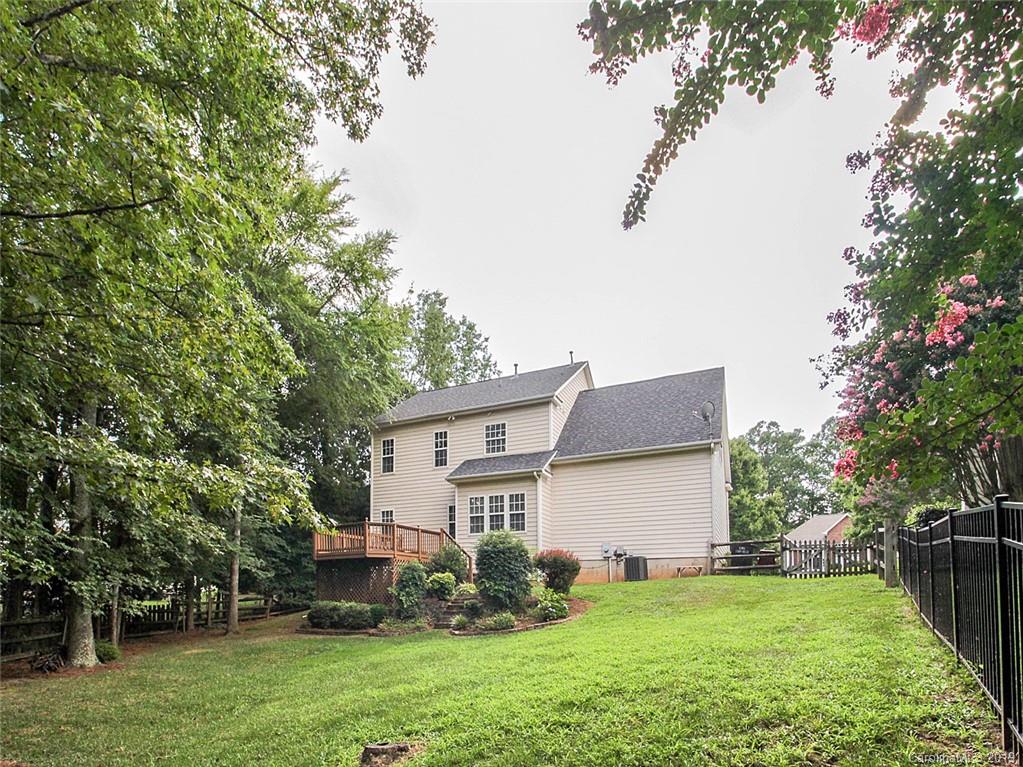 854 Knightsbridge Road Fort Mill, SC 29708 - Photo 22 of 26 a view of a house with a backyard