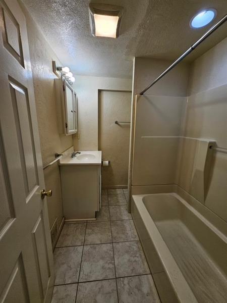 535 3rd Street Pitcairn, PA 15140 - Photo 11 of 13 a bathroom with a bathtub and a sink