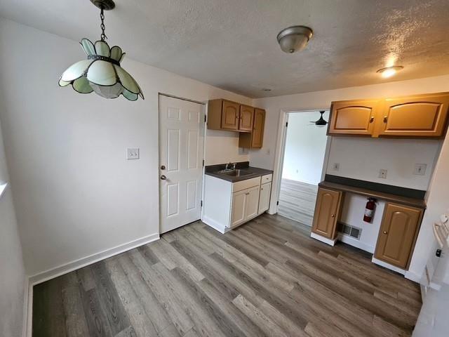 535 3rd Street Pitcairn, PA 15140 - Photo 2 of 13 a kitchen view with wooden floor and a sink