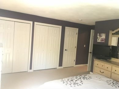 330 Sunderland Road, Unit 78 Worcester, MA 01604 - Photo 11 of 27 a view of a bedroom with wooden floor and cabinet