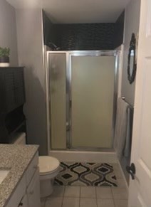 330 Sunderland Road, Unit 78 Worcester, MA 01604 - Photo 16 of 27 a bathroom with a granite countertop sink toilet and shower