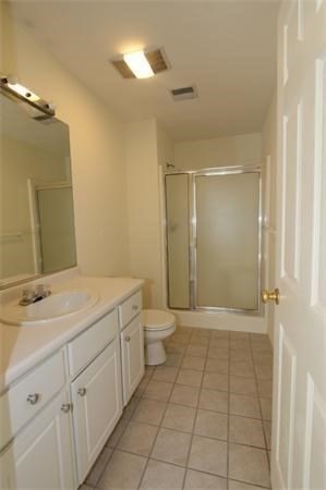 330 Sunderland Road, Unit 78 Worcester, MA 01604 - Photo 17 of 27 a bathroom with a granite countertop sink a toilet and a mirror