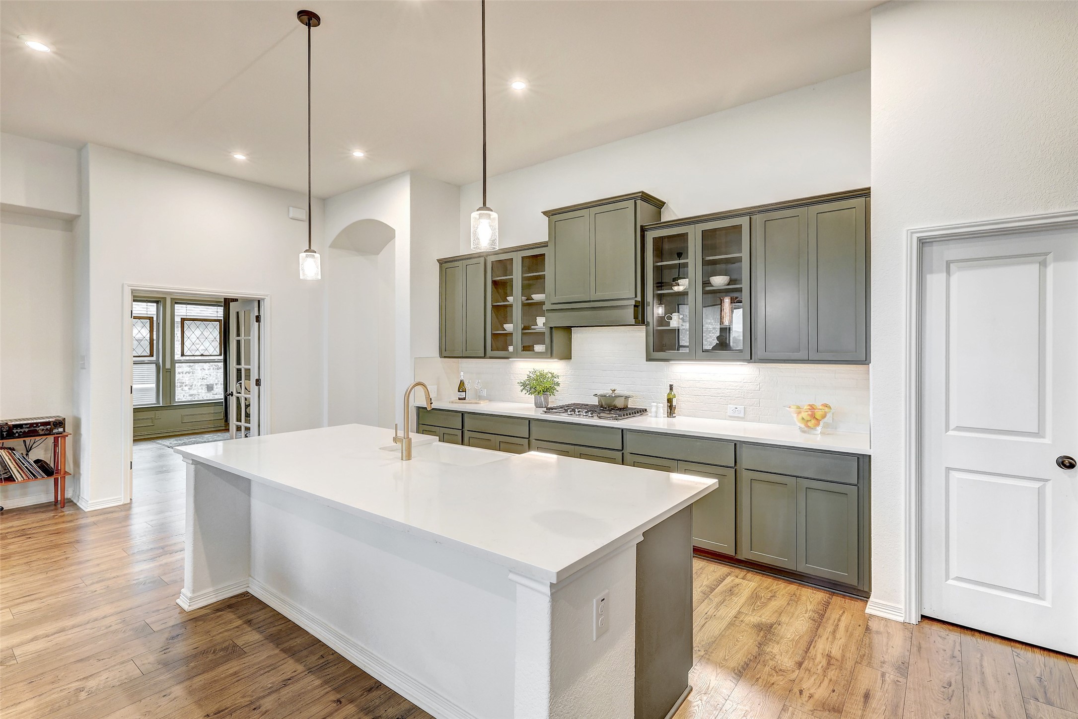 1117 Spring Gulch Lane Georgetown, TX 78628 - Photo 12 of 39 Culinary creations come to life in this kitchen, featuring an expansive island and a gas range.
