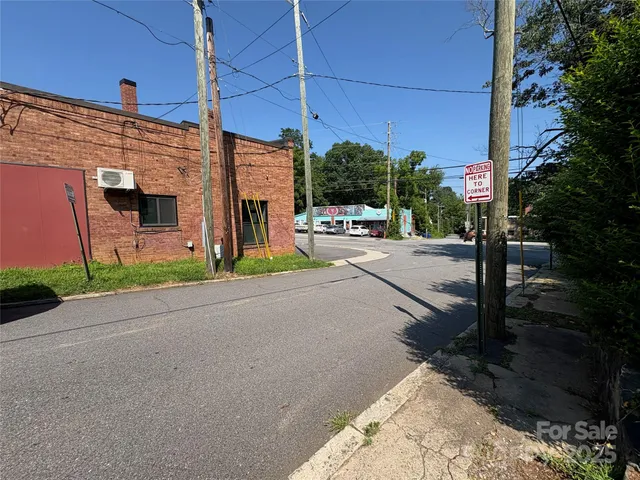 a view of a street with a building