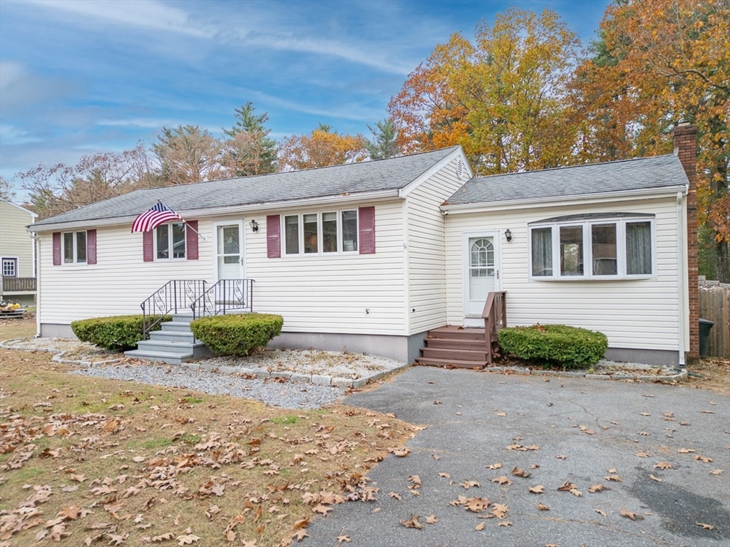 30 Emery Road Townsend, MA 01469 - Photo 1 of 35 a front view of a house with a yard and garage