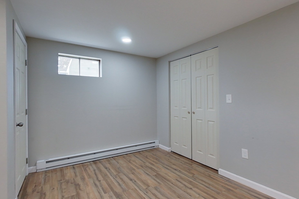 30 Emery Road Townsend, MA 01469 - Photo 24 of 35 a view of an empty room with wooden floor and a window
