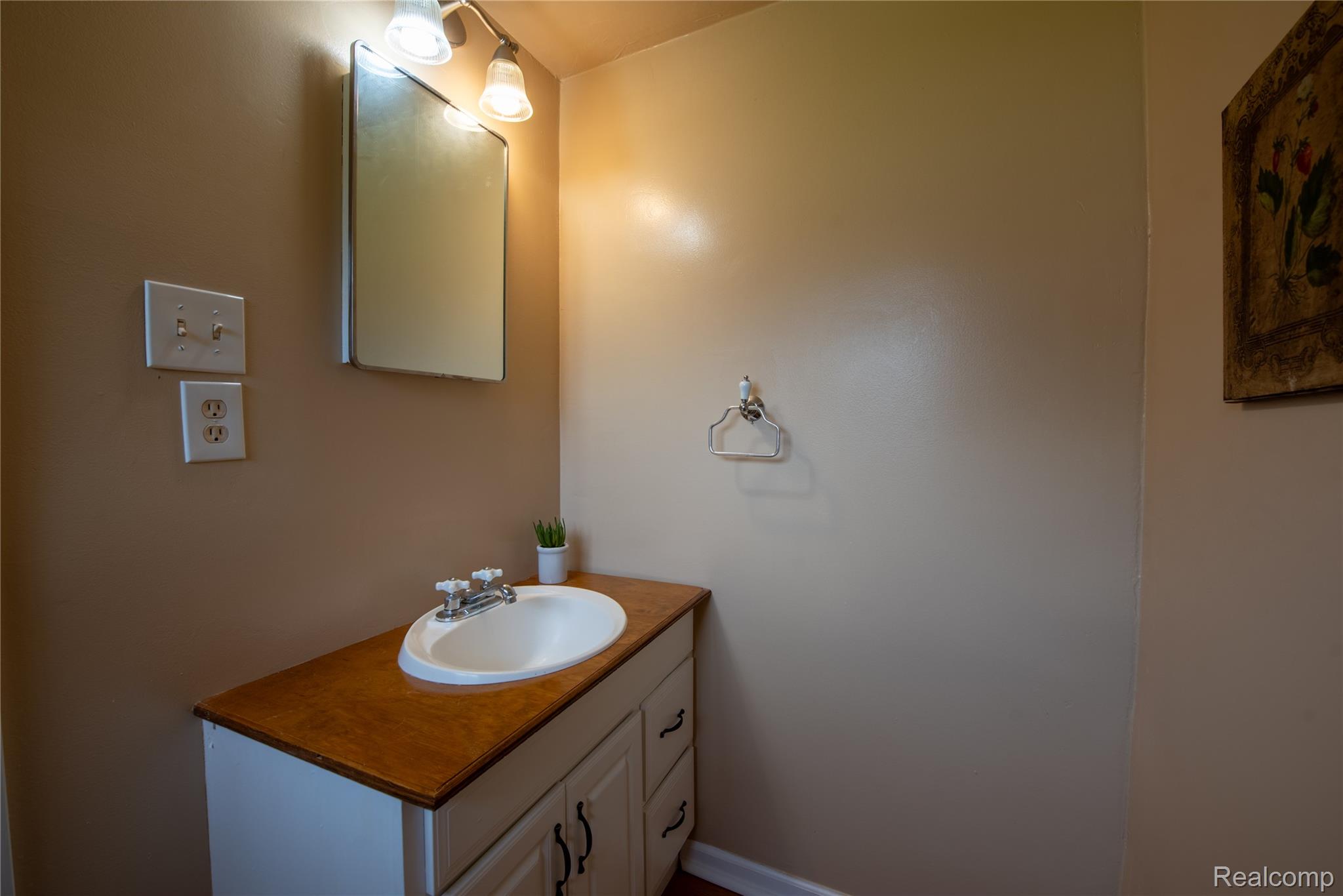 1190 Meadow Road Tawas City, MI 48763 - Photo 16 of 26 Bathroom featuring vanity
