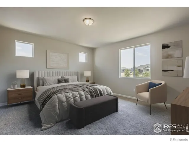 a bedroom with a bed window and couch