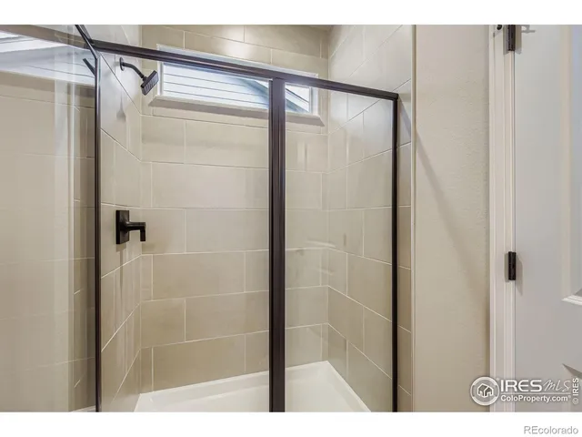 a bathroom with a bathtub and a mirror