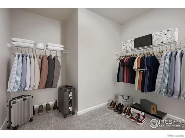 a spacious bedroom with a bed and window