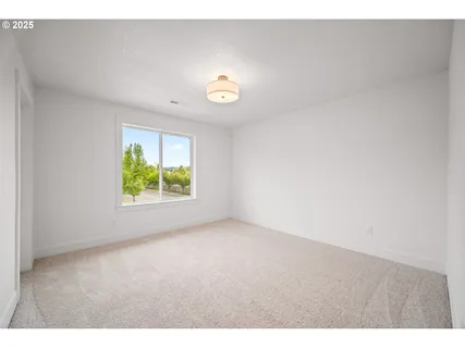 a bathroom with a double vanity sink a toilet and a mirror